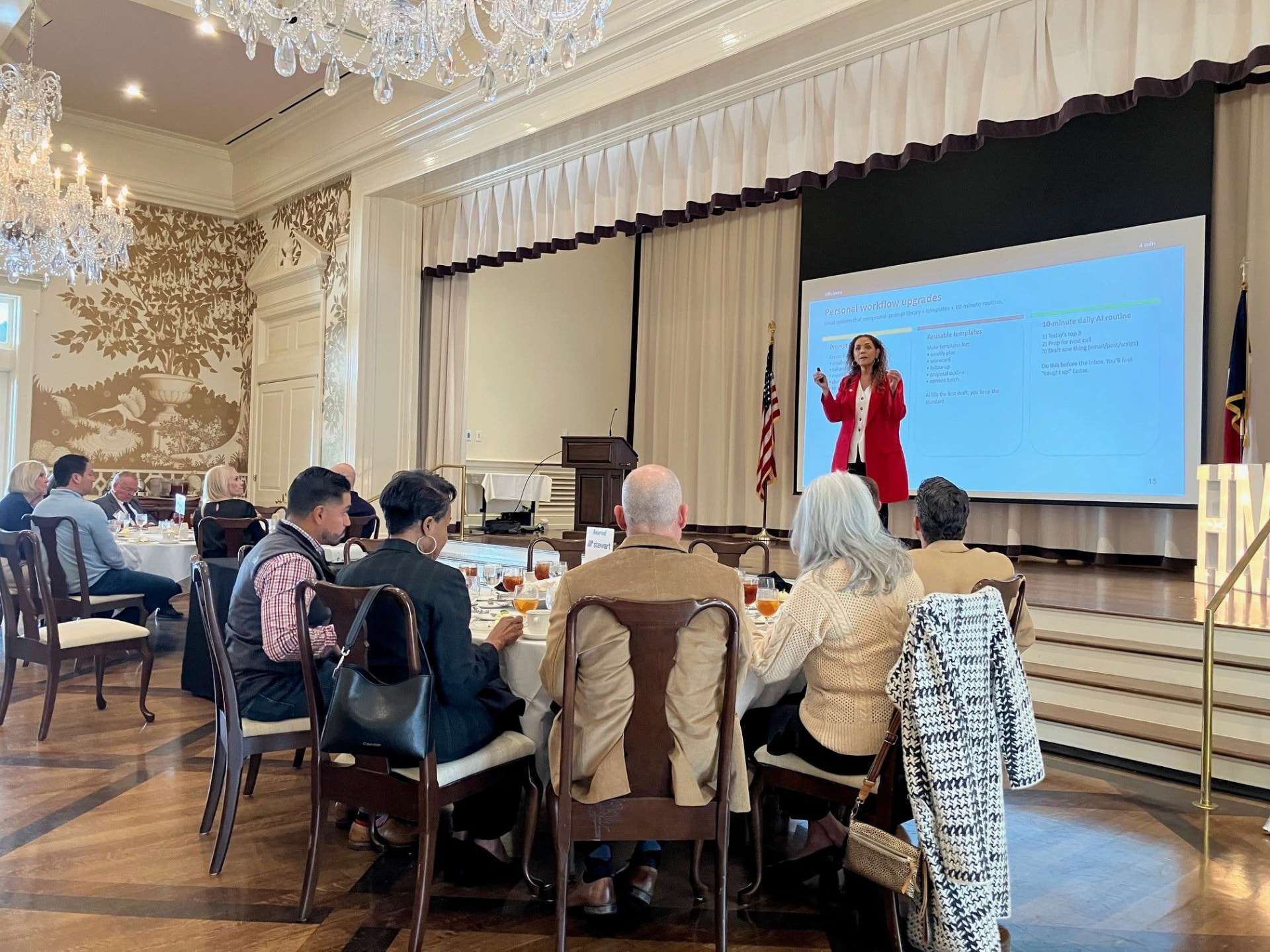 Suha Beidas Zehl, CMB®, AMSP™ presenting AI workflow slides to a seated audience